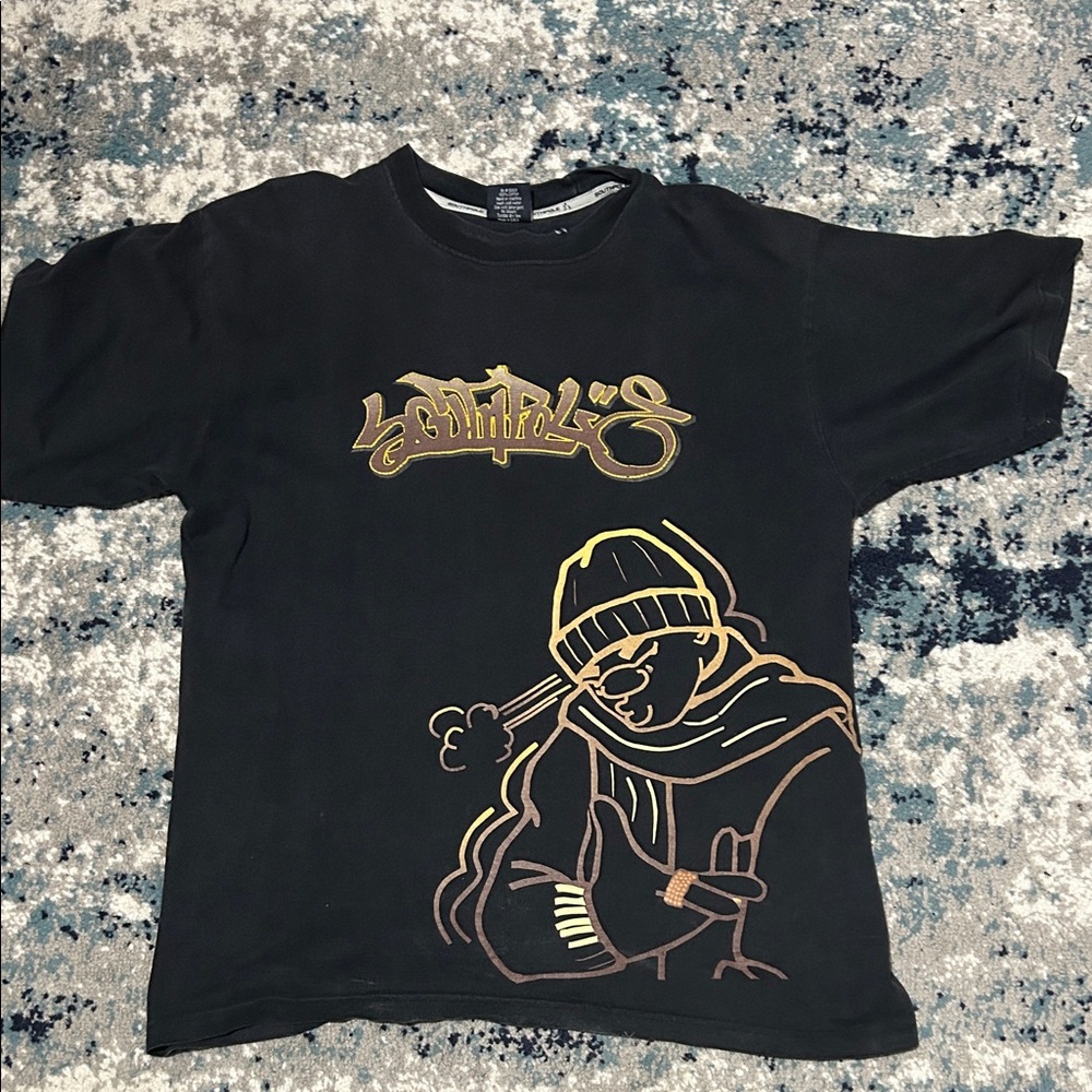 Stylish Black Graphic Tee with Gold Accents